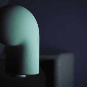 A green lamp on a table in a dark room.